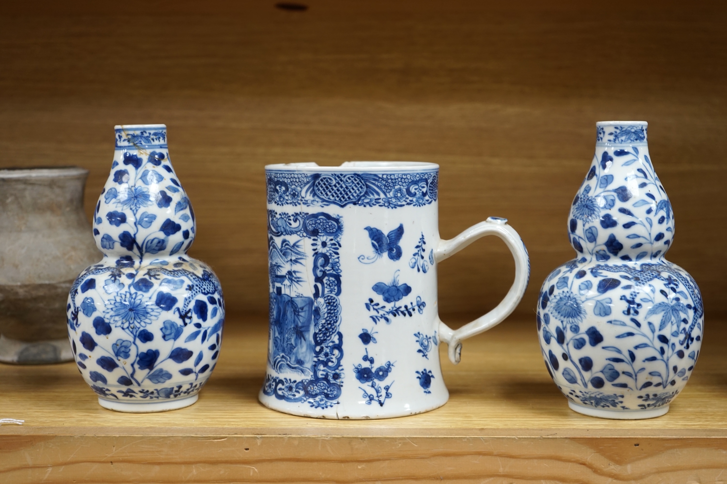 A pair of Chinese blue and white double gourd shaped vases, 19th century and a large export tankard, 18th century, largest 19cm high. Condition - poor